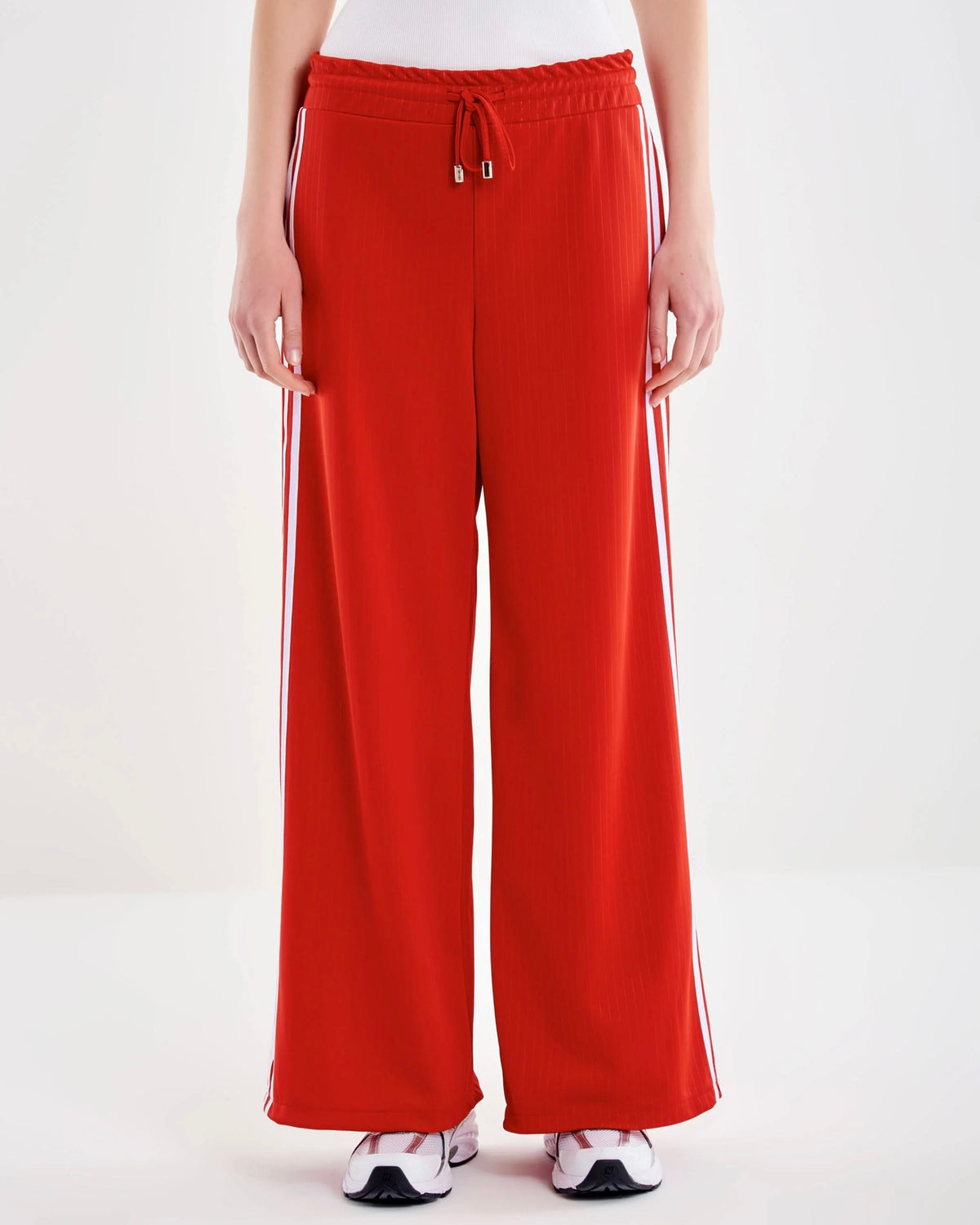 Track pants with galloon stripes in red