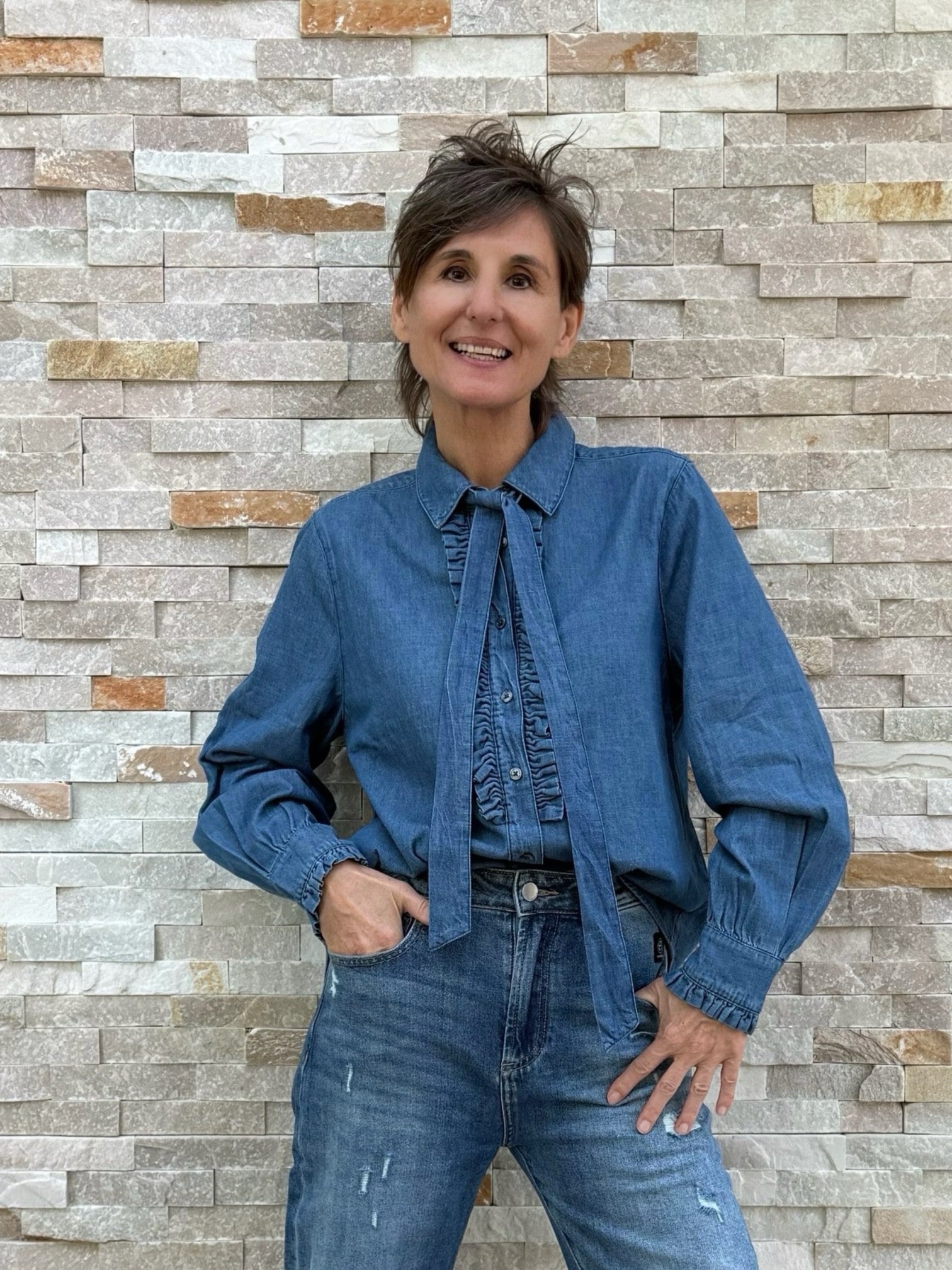 Jean Blouse with Ruffle Details and Bow in Mid-Blue