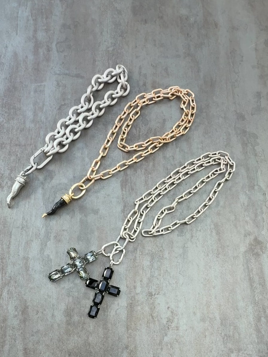 Load video: CORNO ORO large cross pendant in black and silver